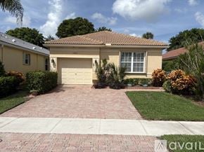 Delray Beach house for rent - A house with a driveway in front of it.