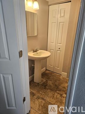 Gibsonton apartment for rent - A bathroom with a sink and mirror.