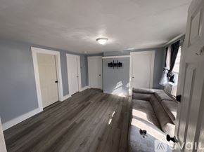 Taunton apartment for rent - A room with wooden flooring and white walls.