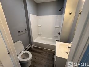 Taunton apartment for rent - A bathroom with a toilet, sink, and bathtub.