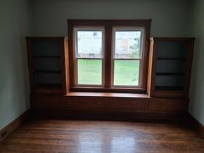 Cleveland apartment for rent - A room with a window and wooden floors.