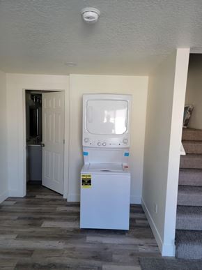 Herriman house for rent - A small white fridge with a sticker on it.