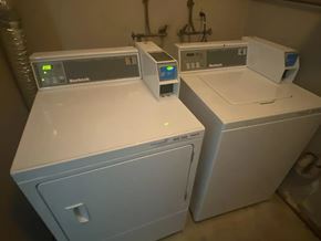 Edmonton apartment for rent - Two white ovens with digital displays on top.
