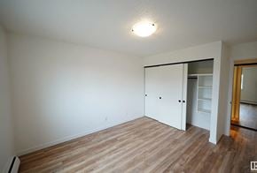 Edmonton apartment for rent - A room with a white door and a light on the ceiling.