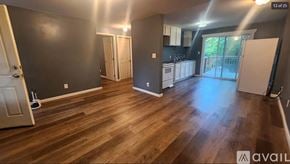 Oak Ridge apartment for rent - A room with wooden flooring and a white door.