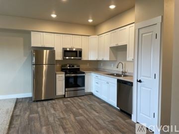 Missoula apartment for rent - A kitchen with white cabinets and stainless steel appliances.