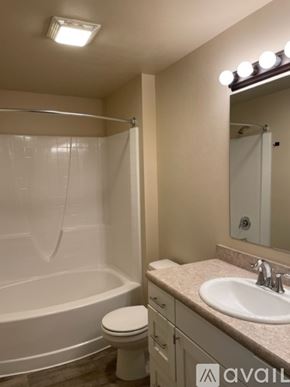 Missoula apartment for rent - A bathroom with a toilet, sink, and shower.