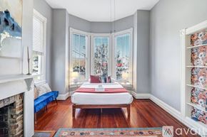 Savannah apartment for rent - A bedroom with a bed in the middle of the room.