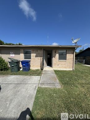 Copperas Cove house for rent - A house with a satellite dish on the roof and a blue trash bin in front.