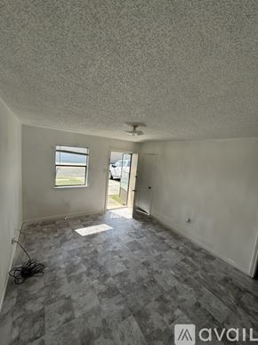 Copperas Cove house for rent - A room with a checkered floor and a door leading to a balcony.