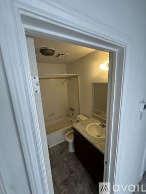Copperas Cove house for rent - A bathroom with a toilet, sink, and bathtub.
