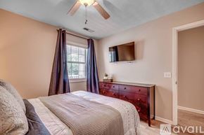 Myrtle Beach condo for rent - A bedroom with a bed, dresser, and window.