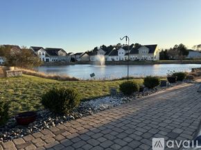 Selbyville condo for rent - A sunny day at a residential area with a lake and houses.