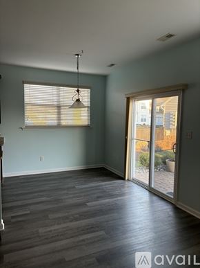 Selbyville condo for rent - A room with a window and sliding glass doors.