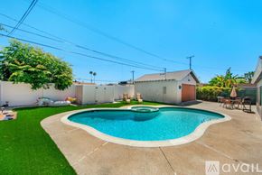 Garden Grove house for rent - A backyard with a pool and a patio area.