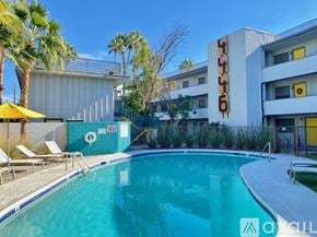 Phoenix apartment for rent - A pool in front of a building with the name "CYLUS" on it.