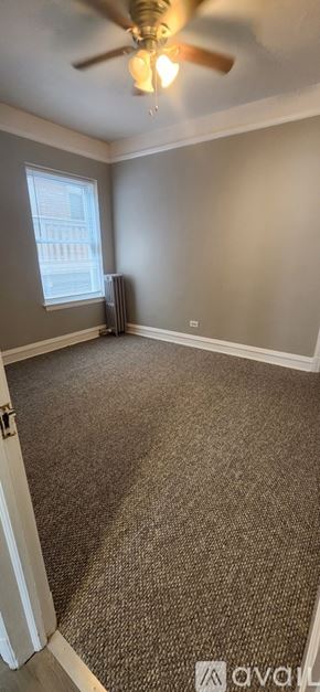 Oak Park apartment for rent - A living room with a fireplace and a rug.