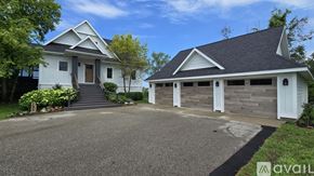 Onekama house for rent - A two-story house with a garage is available for sale.