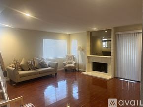 San Diego townhouse for rent - A living room with a fireplace and a couch.