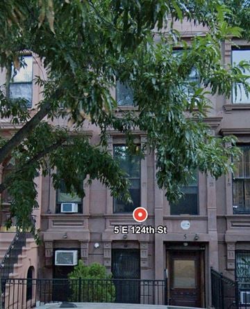 New York apartment for rent - A brown building with the number 5E124th St on it.