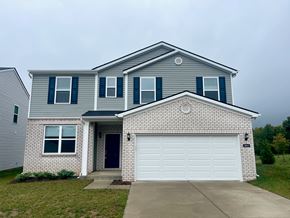 Louisville house for rent - A house with a grey roof and a white garage door.