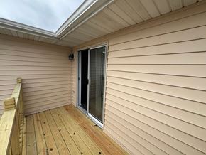 Fremont apartment for rent - A wooden deck with a sliding glass door.