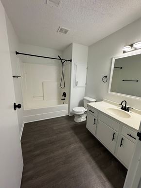 Fremont apartment for rent - A bathroom with a toilet, sink and mirror.