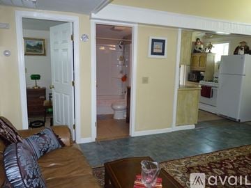Wareham house for rent - A living room with a brown couch and a coffee table.