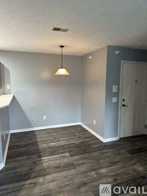 Caledonia condo for rent - A room with a grey wall and a white door.