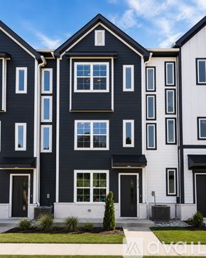 Nashville apartment for rent - A modern two-story building with a black and white exterior.