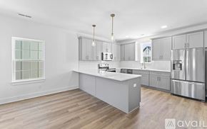 Nashville apartment for rent - A kitchen with a white countertop and stainless steel appliances.