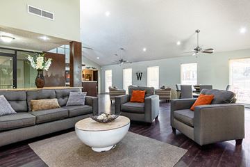 Irving apartment for rent - A living room with grey couches and a white coffee table.