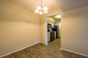 Irving apartment for rent - A kitchen area with a refrigerator, microwave, and oven.
