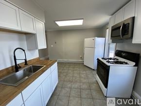 Duboistown apartment for rent - A long hallway with white walls and wood flooring.