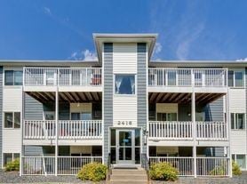Fargo apartment for rent - A building with a balcony and a door numbered 241.