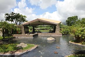 Honolulu apartment for rent - A pond with a gazebo in the middle of it.
