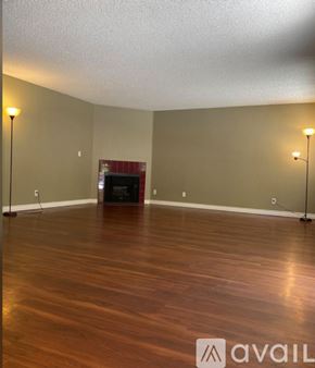 Valley Glen apartment for rent - A room with wooden floors and a fireplace.