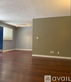 Valley Glen apartment for rent - A room with wooden flooring and a wall with a switch.