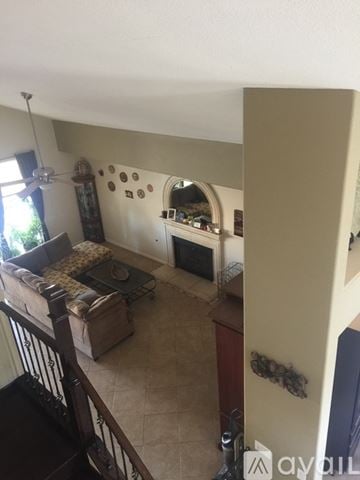 Phoenix house for rent - A living room with a couch and a fireplace.