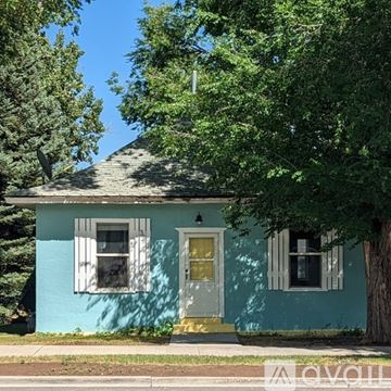 Roosevelt house for rent - A kitchen with white cabinets and a window above the sink.
