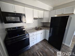 La Crosse apartment for rent - A room with wooden flooring and a door on the right side.