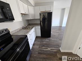 La Crosse apartment for rent - A room with wooden flooring and a white door.