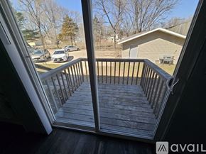 La Crosse apartment for rent - A grey building with a sign that says "No Parking" in front of it.