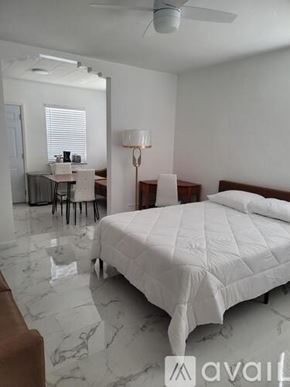 Miami Beach apartment for rent - A bedroom with a bed, desk, and chair.