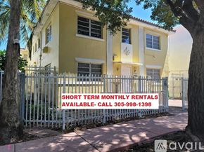 Miami Beach apartment for rent - A sign in front of a building advertises short term monthly rentals.