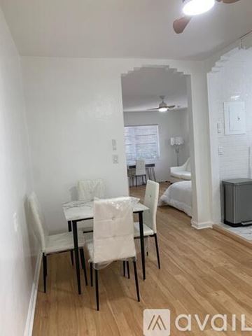 Miami Beach apartment for rent - A dining room with a table and chairs.
