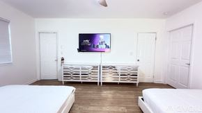 Miami Beach apartment for rent - A kitchen with white cabinets and a sink.