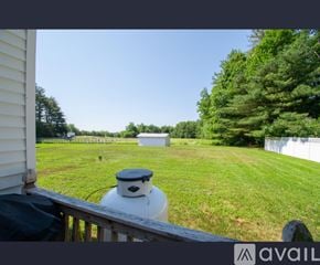 Lisbon townhouse for rent - A white propane tank sits on a wooden deck.