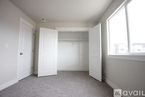 Lehi apartment for rent - A room with a carpeted floor and white walls.