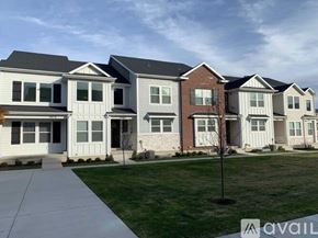Lehi apartment for rent - A row of houses with the first one having a white door and the second one having a brown door.